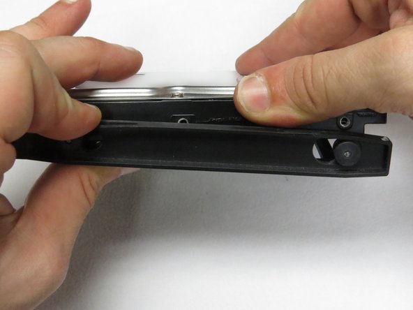 Install the new HDD into the drive caddy.