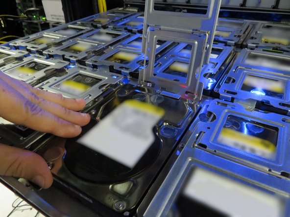 Push the HDD toward its socket to connect the HDD.