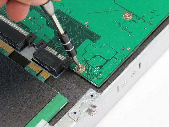 Install the thirteen Phillips #1 screws that were previously removed.