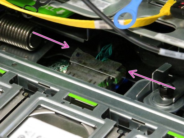 Pull the cable towards the rear until it unseats from its connector.