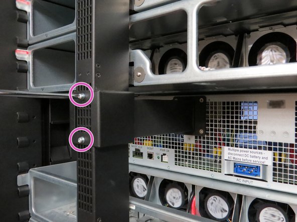 Install (2) Phillips head screws as shown.