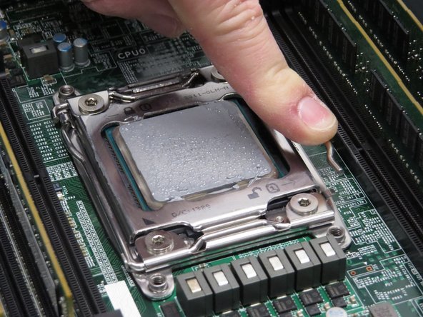 Press the lever down and away from the CPU.