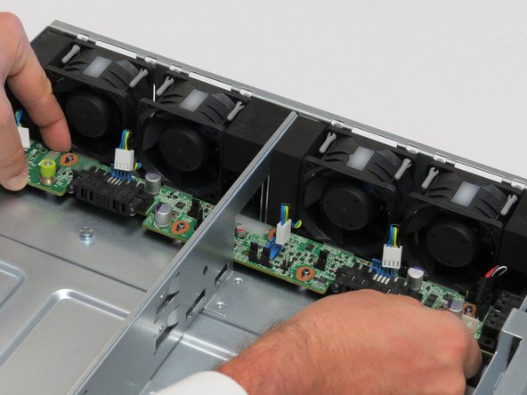 Push the midplane board towards the fans.