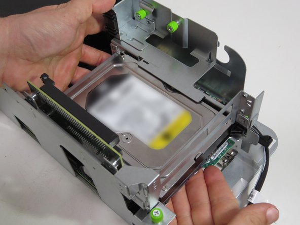 Lift the riser card assembly from the server.