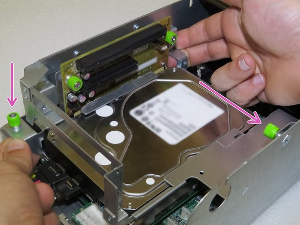 Loosen the two thumbscrews.