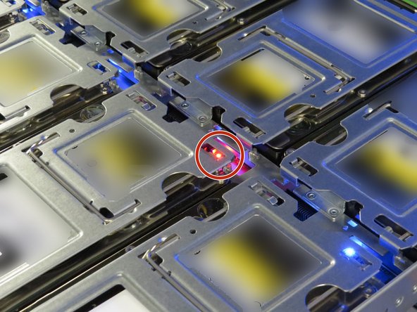 Find the failed hard disk drive by locating a the red LED next to the drive.