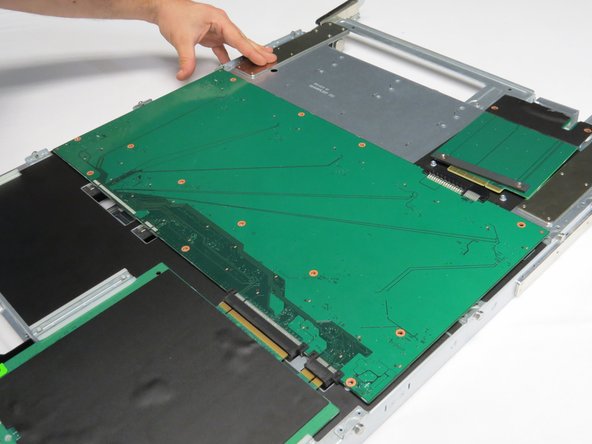 Place a new drive plane board into the storage chassis.