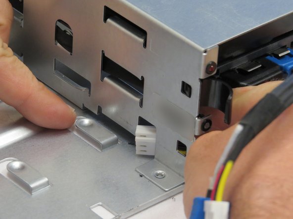 Pull the power connection end of the SATA / Power cable towards the server hard disk drives, as shown.