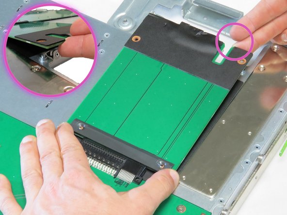 Tilt the power transition board at a slight angle upwards, as shown.