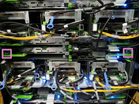 Locate the two tray release levers.