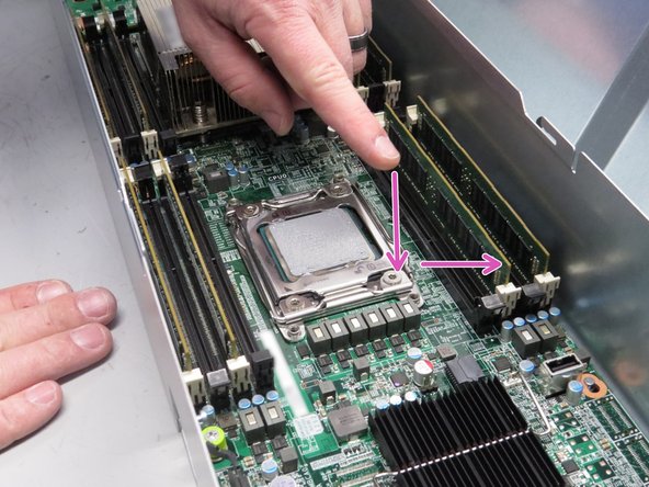 Press the CPU retention lever down and away from the CPU.