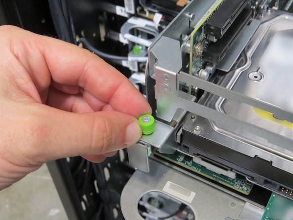 Loosen the (2) thumbscrews, shown.