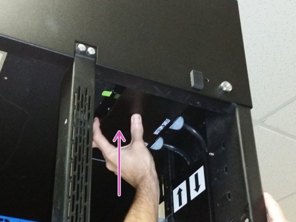 Align the three tabs on the PDU chassis with the three slots in the top of the rack.