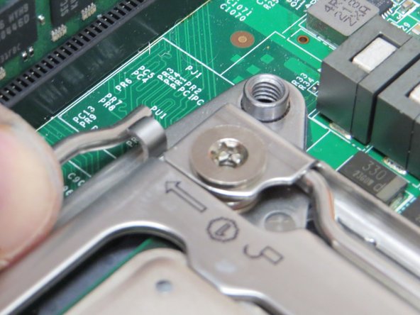 Lower and lock the CPU retention levers, as shown.