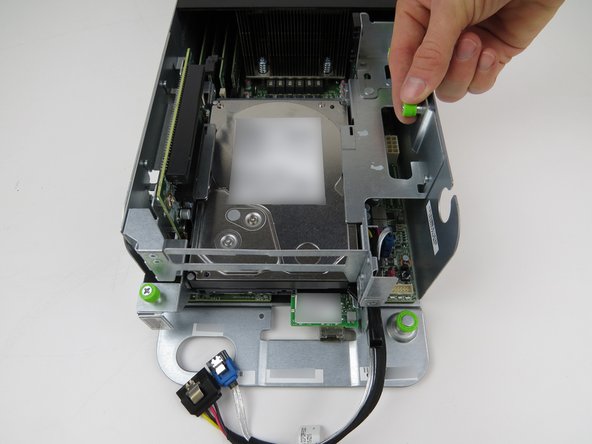 Loosen the (2) green thumbscrews, shown.