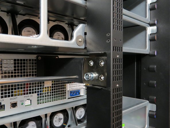 Continue removing the remaining screws until the output blade is free from the bus bar.