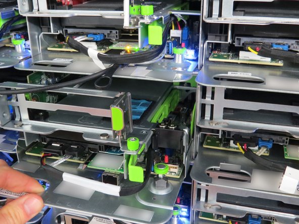 Using the handle, pull the server away from the rack as shown.