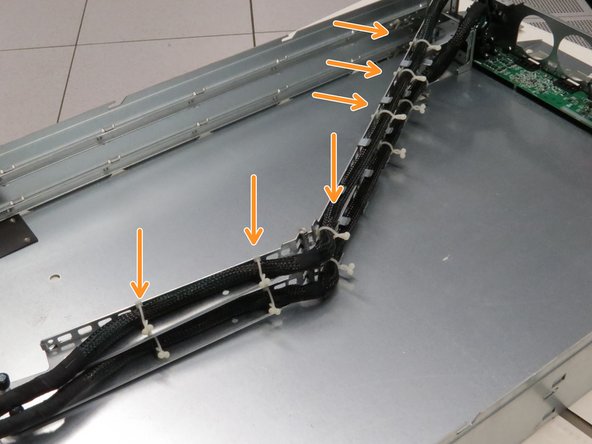 Untether the cable from the chassis by untwisting the six nylon cable management ties.
