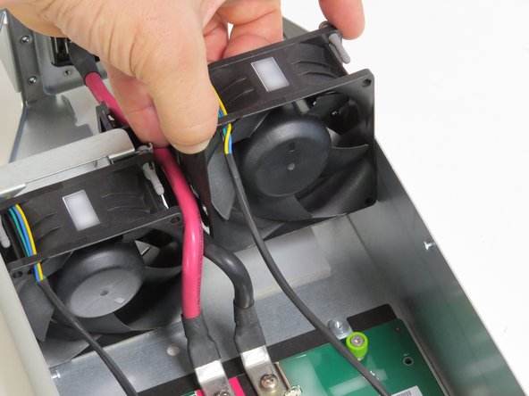 Lift the fan from the system.