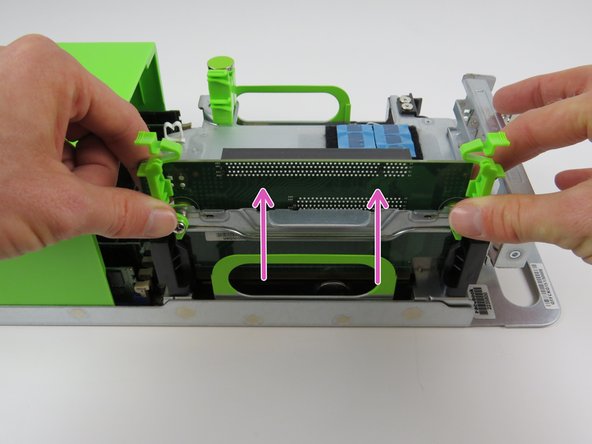 Grasp the PCI riser card, as shown and lift the card from its socket to remove.
