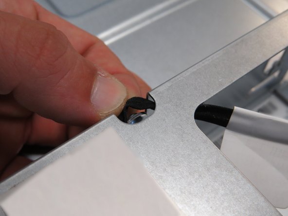 Release the LED cable from the remaining cable management brackets within the HDD cage.