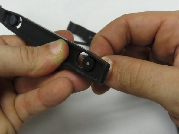 If the rubber grommets fall out, insert them as shown.