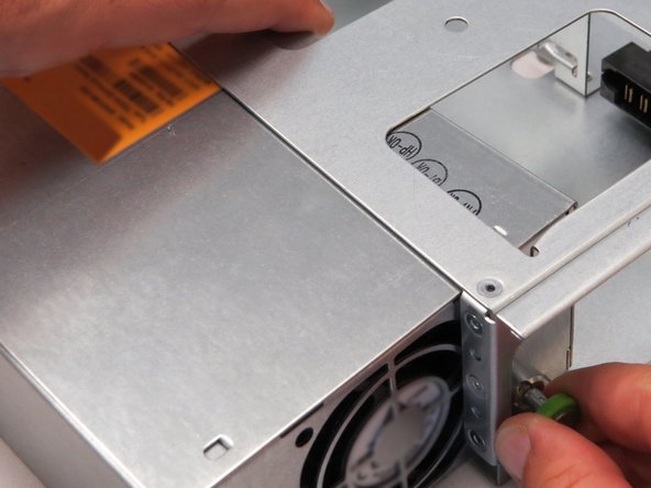 Pull the retention plunger away from the chassis.