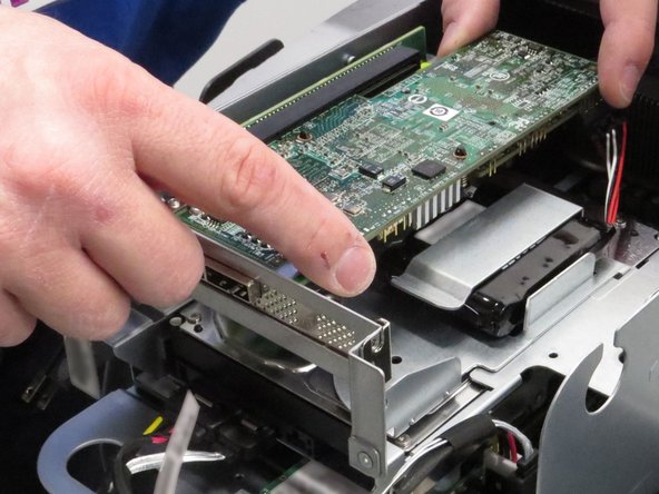 Pull the RAID controller from the PCI riser card socket.