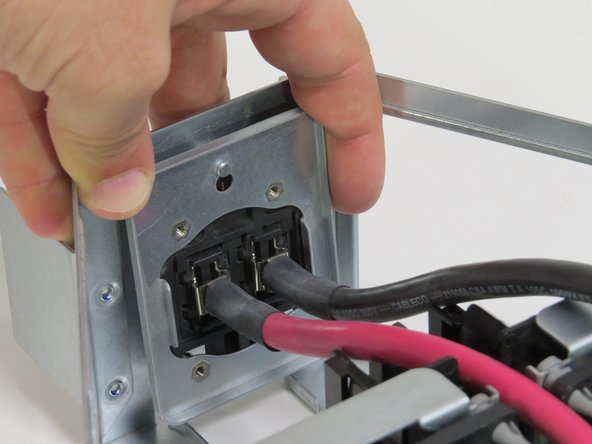 Pull the bus lead retention bracket upwards until resistance is felt.