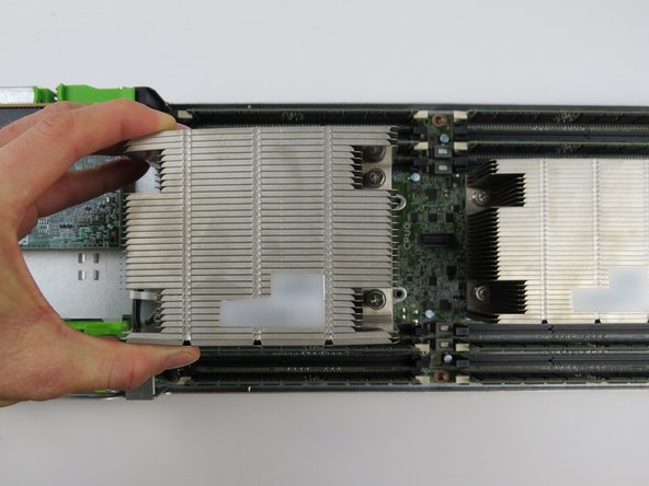 Place the heatsink to the side of the server chassis, near its respective CPU socket.