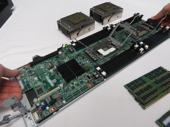 Lift the motherboard away from the server sled.