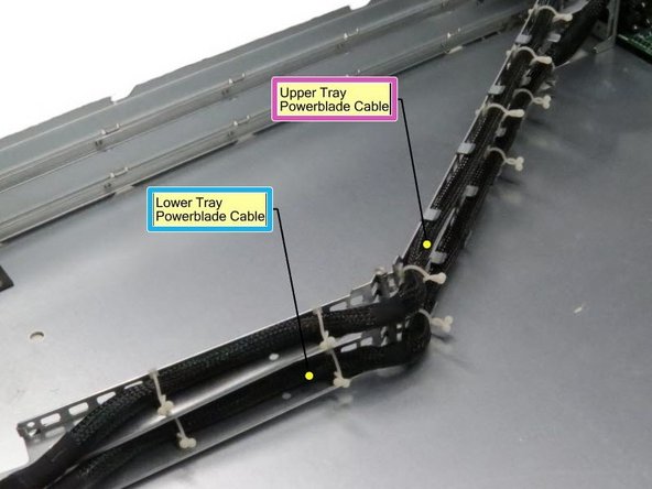 Be mindful of the orientation of the two Powerblade cables. The top-most tray Powerblade cable connects to the socket labeled UPPER TRAY. The lower tray Powerblade cable connects to the socket labeled LOWER TRAY.