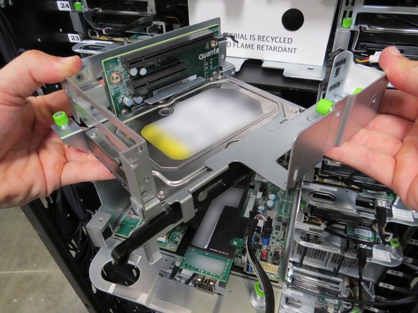 The PCI riser card will be properly unseated when a distinctive 'click' is felt.