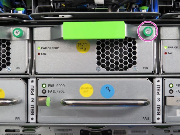 Identify the location of the degraded PSU and loosen the green thumbscrew.