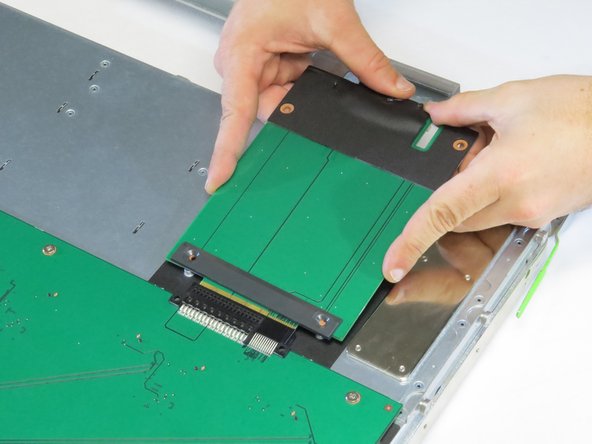 Push the board into its connector.