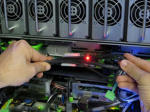 Secure the SAS cable in the nylon cable management clip.