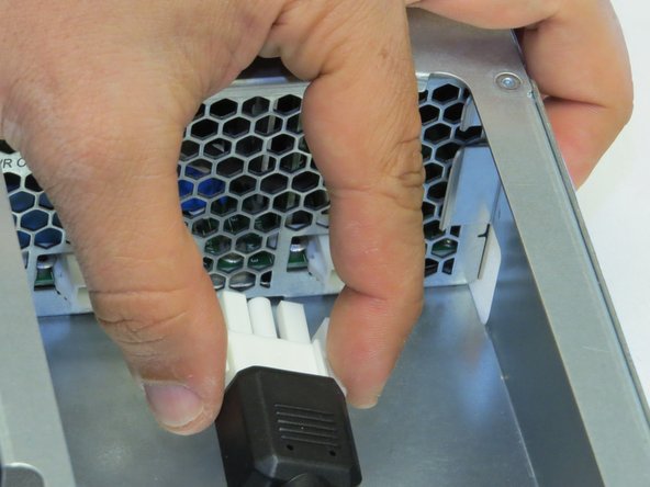 Make sure to pinch the connector tabs to release the cables..