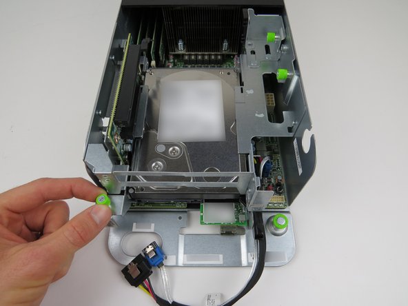 Loosen the (2) green thumbscrews, shown.