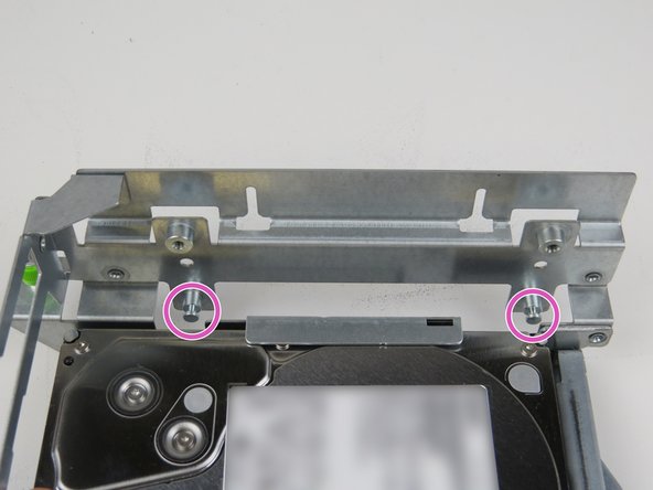 Align the riser card guides with the (2) metal studs on the riser cage.