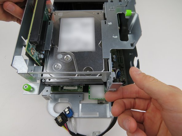 Pull the PCI riser card assembly upwards and remove the assembly from the server.