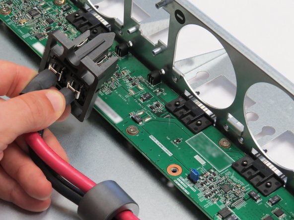 Remove the bus bar clip from the Open Vault chassis.