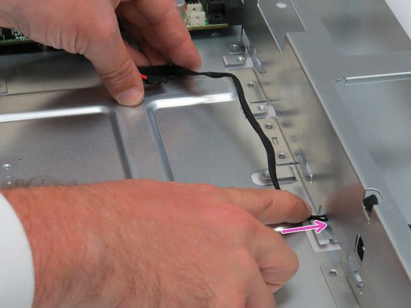 Route the LED through the chassis cutout as shown.