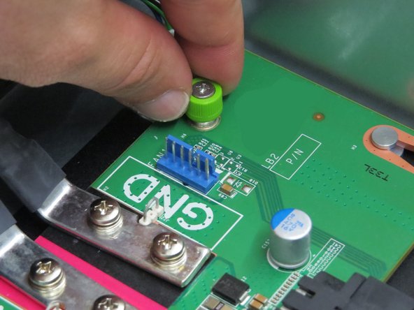 Use a Phillips #2 screwdriver if the thumbscrew is tight.