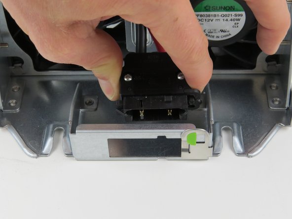 Remove the power connector from the slide-to-lock panel.