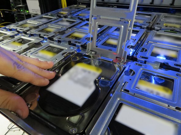 Push the HDD toward its socket to connect the HDD.