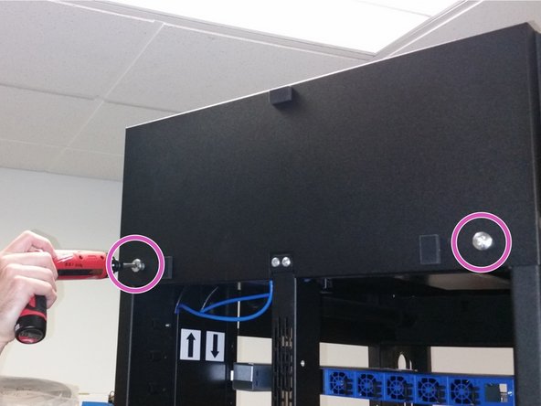 Secure the baffle vertically on the rear of the rack using the (2) M10 screws from the previous step.