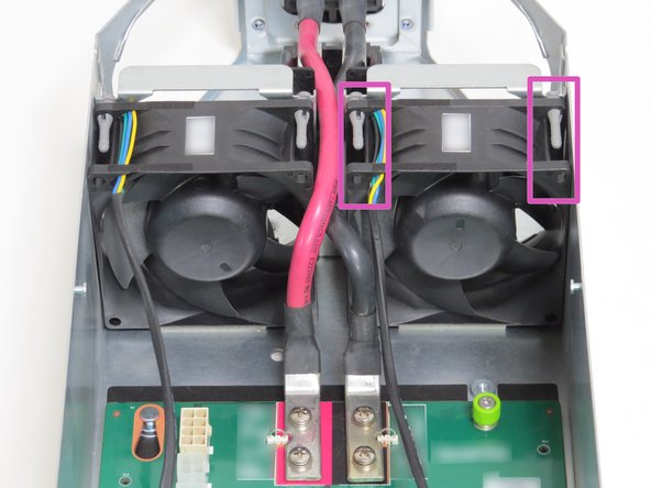 Engage the fan on both sides, as shown.