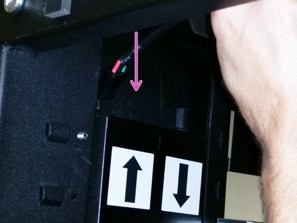 Insert the shorter 3-pin DC power cable into the trough with the arrow facing up (for the upper power shelf).
