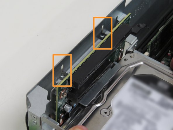 Align chassis keys with the riser card assembly guides, as shown.