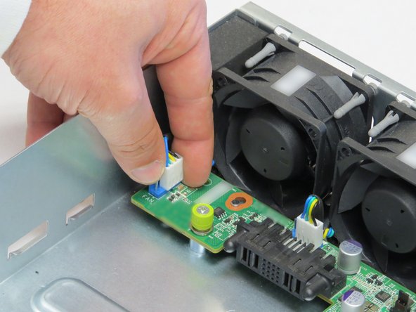 Disconnect the four fan power cables connected to the midplane board.